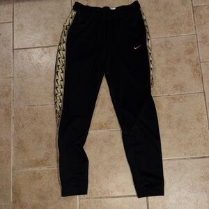 Nike Black and Gold Joggers with Tapered Fit